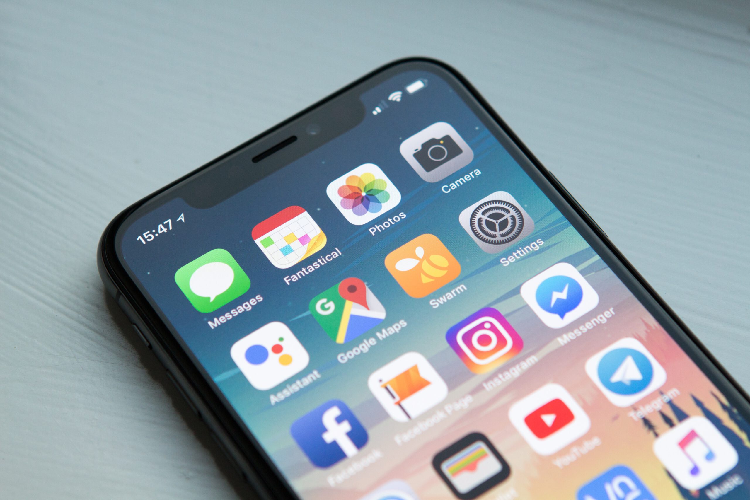 A smartphone showing various social media apps including Instagram